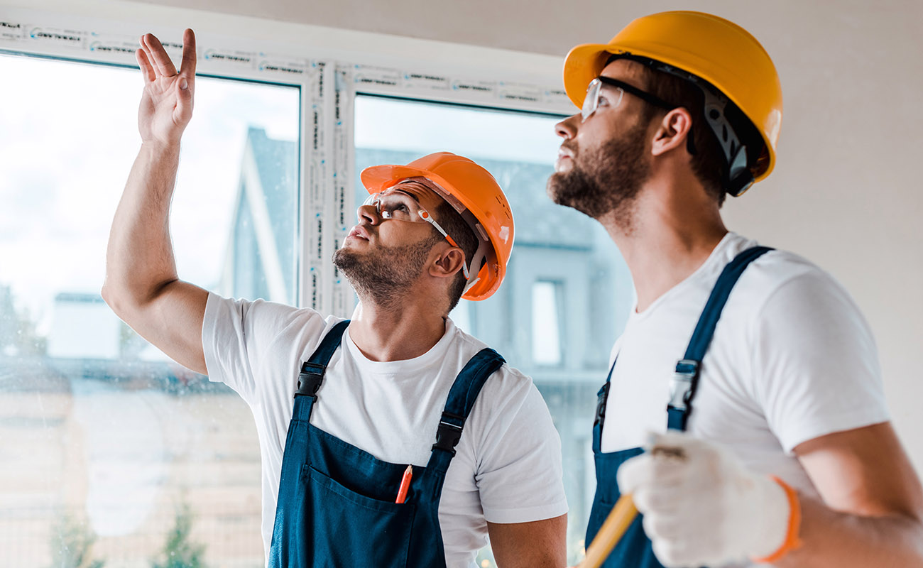 Construction workers remodeling a house.