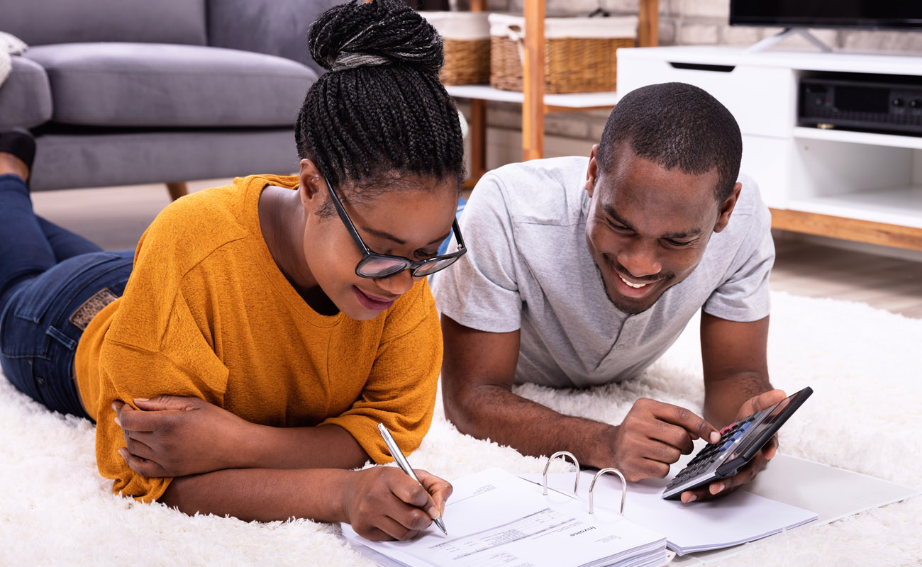 Couple calculating extra payments.