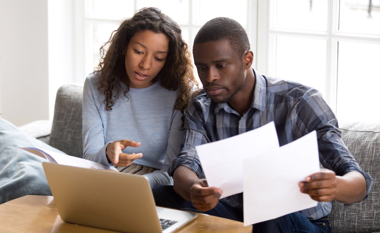 Couple comparing mortgage deals.