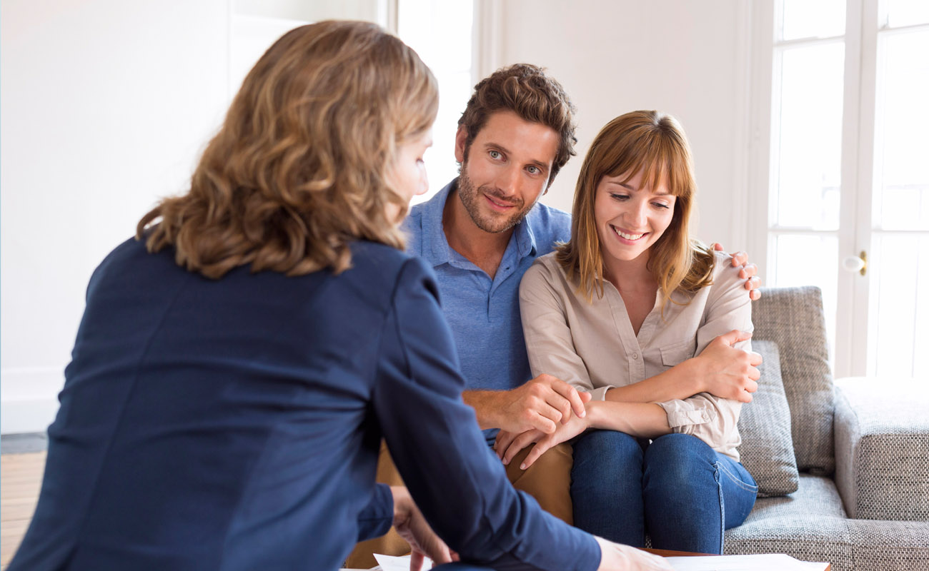 Couple meeting with a real estate agent.