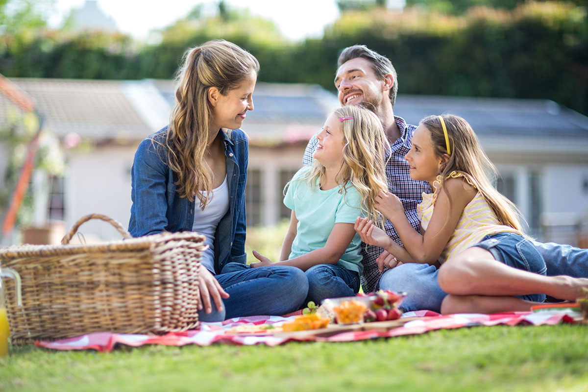 Family Sitting on the Lawn.