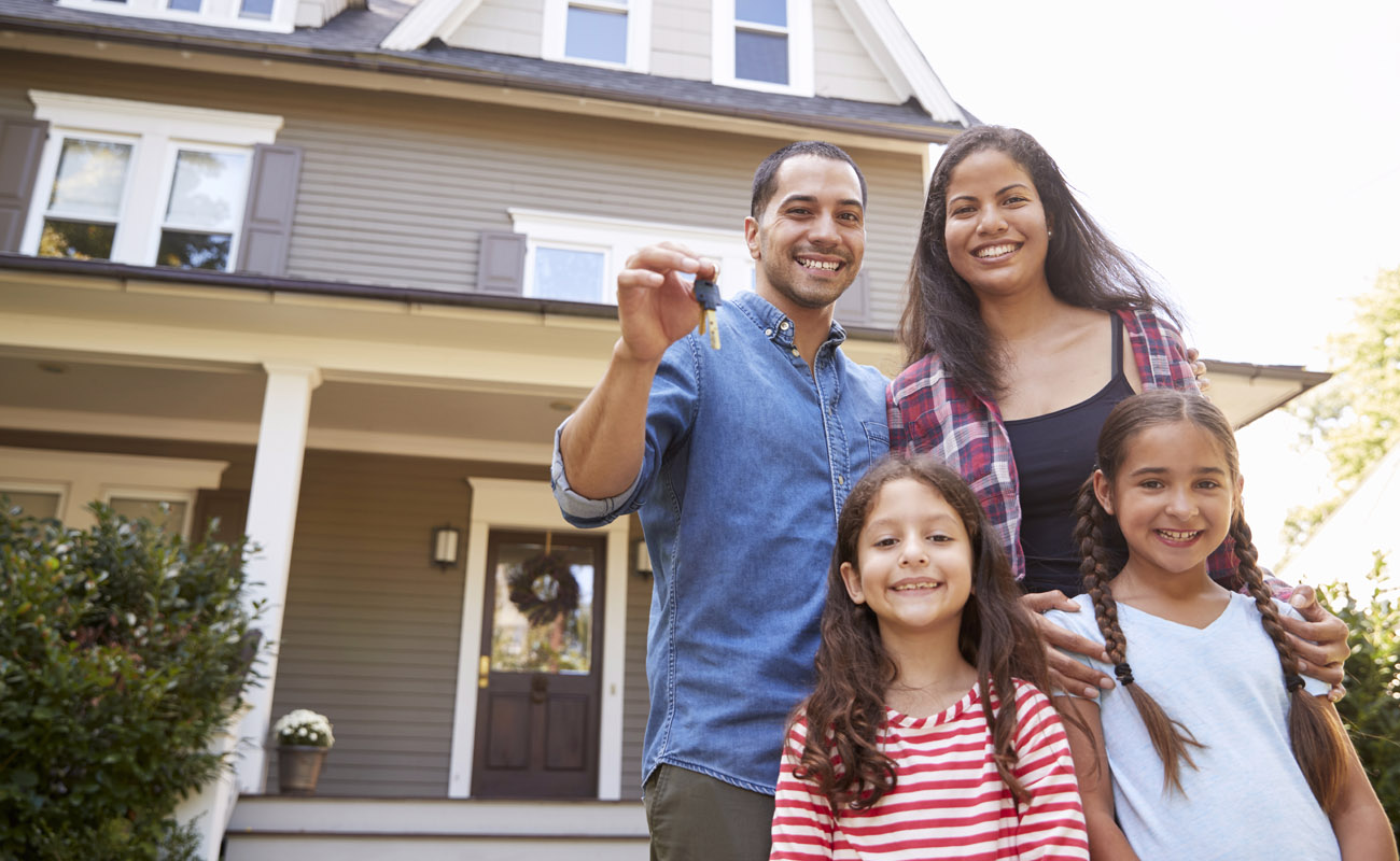 Happy family with a new house.