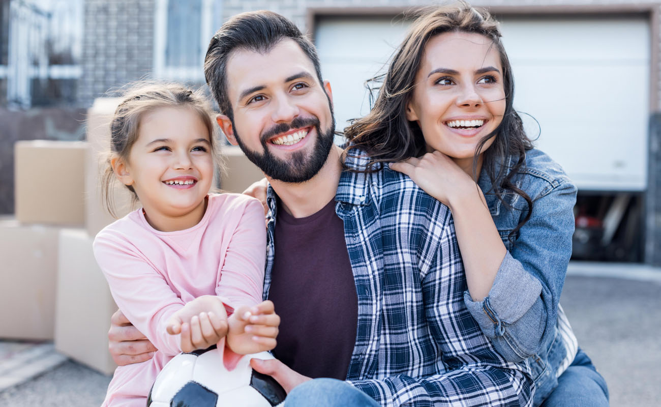 Family moving into their new home.