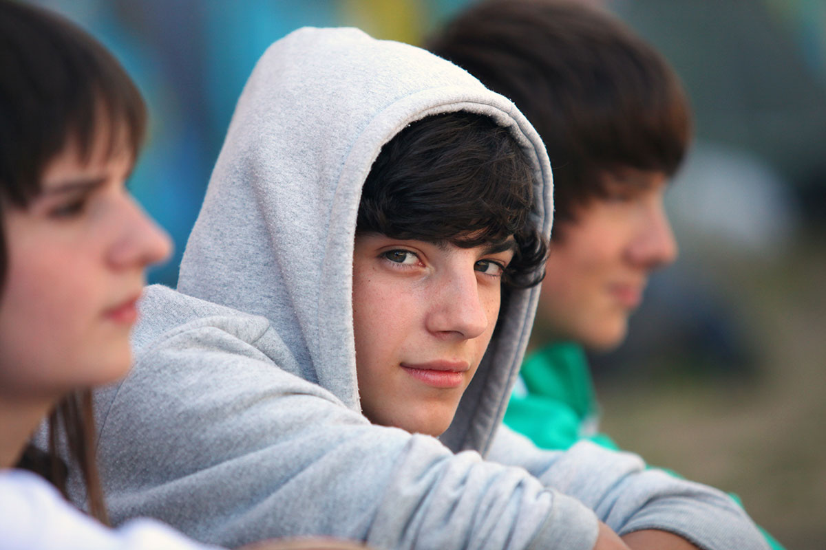 Teenage Boy Sitting.