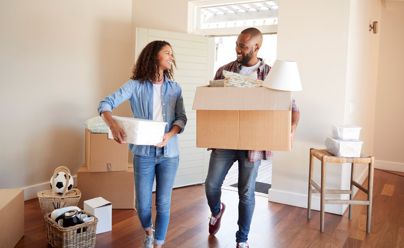 Young couple moving in a rental home.